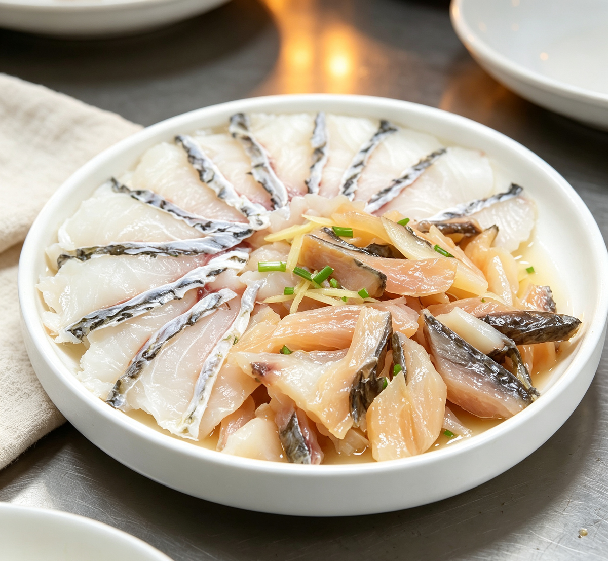 Steamed fish fillets arranged in a round dish