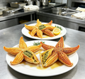 Cooked sea stars plated with lemon and rosemary