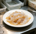 Jellyfish noodles served on a white plate